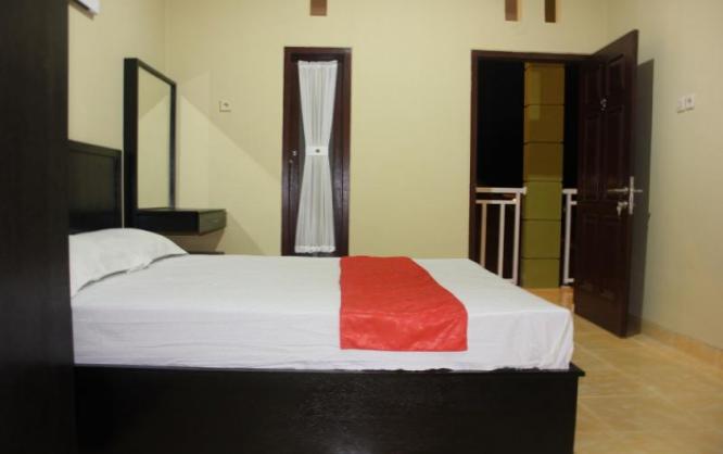 Wisma Santini 2 Type Delux Room Image